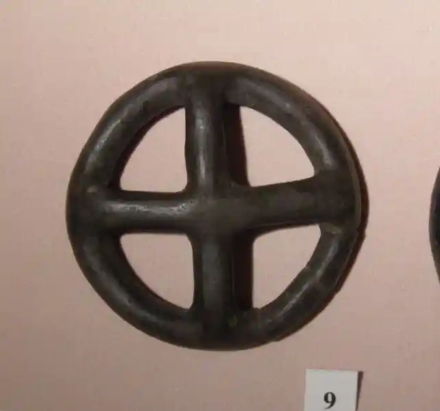 Bronze symbol of the sun disc, solar cross